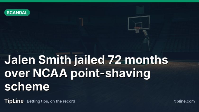 An empty college basketball court at dawn, lights dimmed, hoop in shadow.