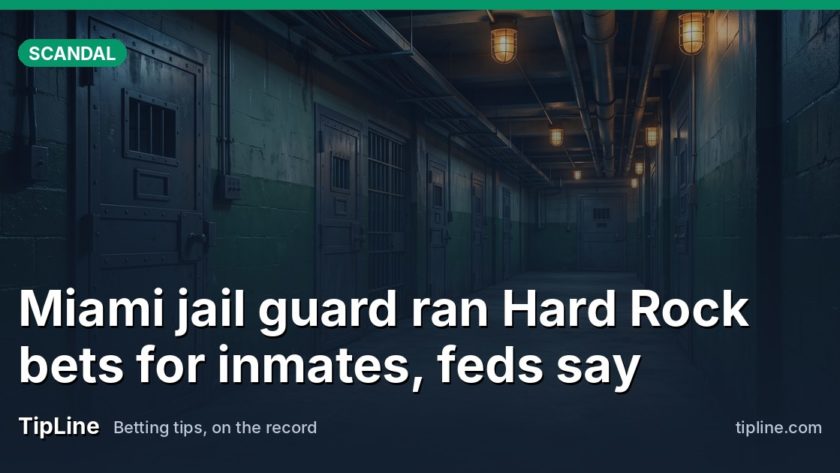 A dim correctional facility corridor with locked steel doors & no visible text or signage.